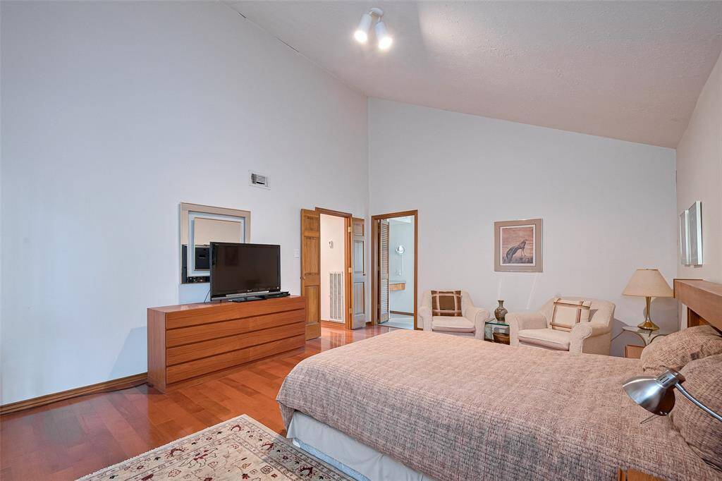 The primary bedroom serves as the perfect retreat for relaxation, offering both comfort and convenience with direct access to its private en-suite bath and walk-in closet.