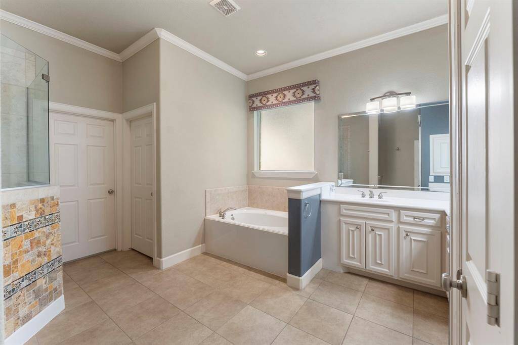 Spacious home office with French doors.