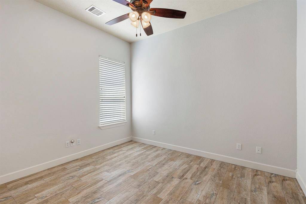 Oversized garage with epoxied floor and insulated garage door.