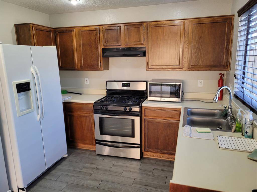 Kitchen with fridge.