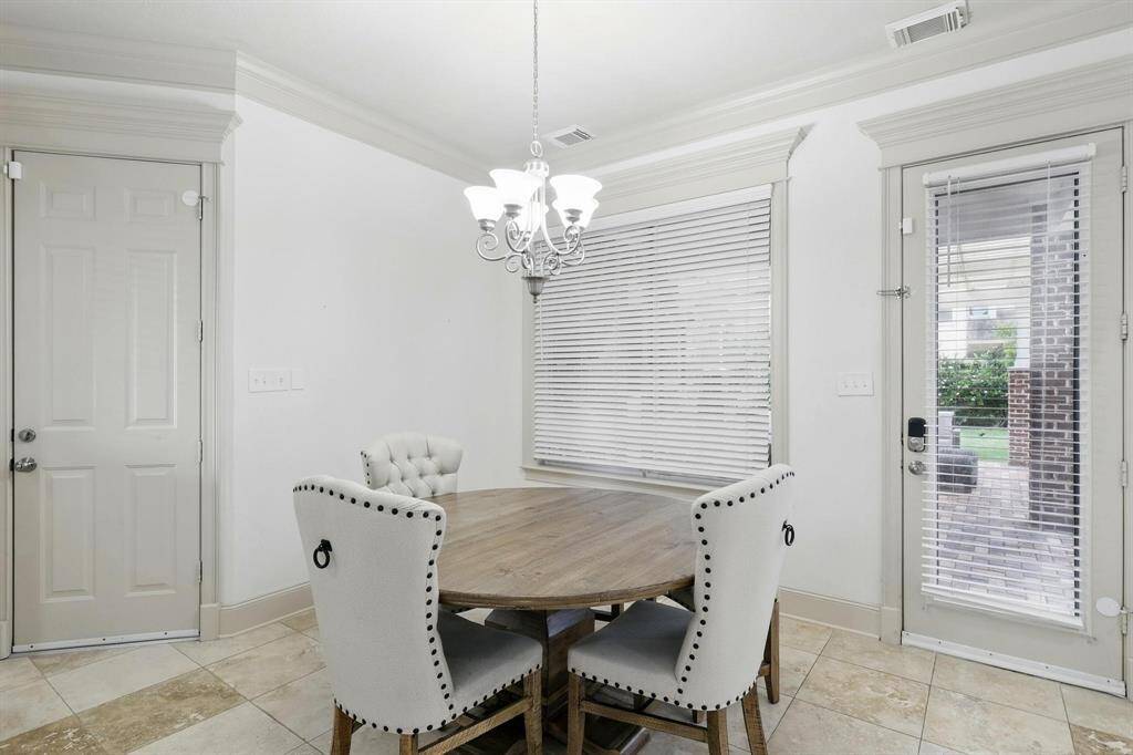 Breakfast nook nestled in a corner of the kitchen, right by the windows