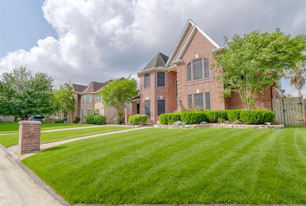 Outside, the property showcases its well-maintained landscaping