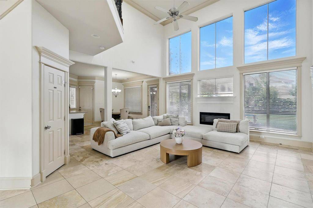 A comfortably modern living room bathed in ample natural and artificial light