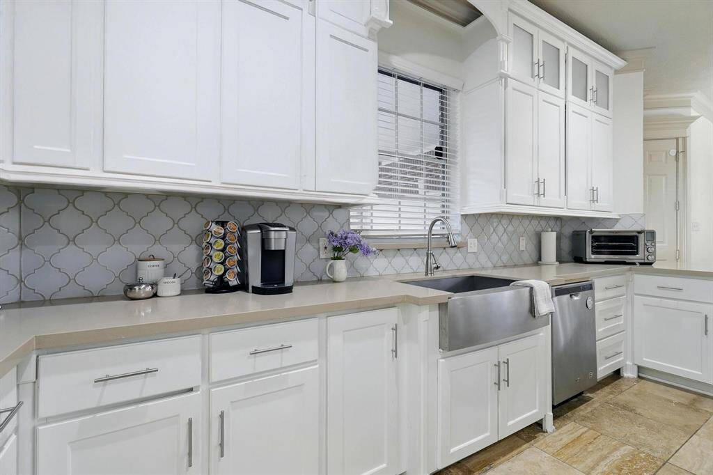 Kitchen has plenty of storage functionality and aesthetic appeal