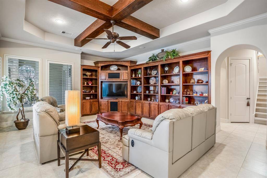 This inviting living room is meant for kicking back and relaxing while watching games & catching up from the day with your loved ones.