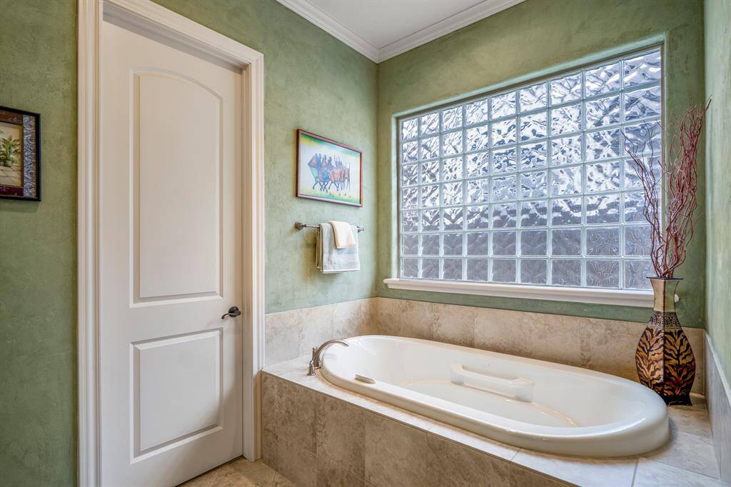 The star of the bathroom is the relaxing soaking tub, offering a spa-like experience within the comfort of your home. Its sleek design invites tranquility, providing an ideal spot to unwind after a long day.