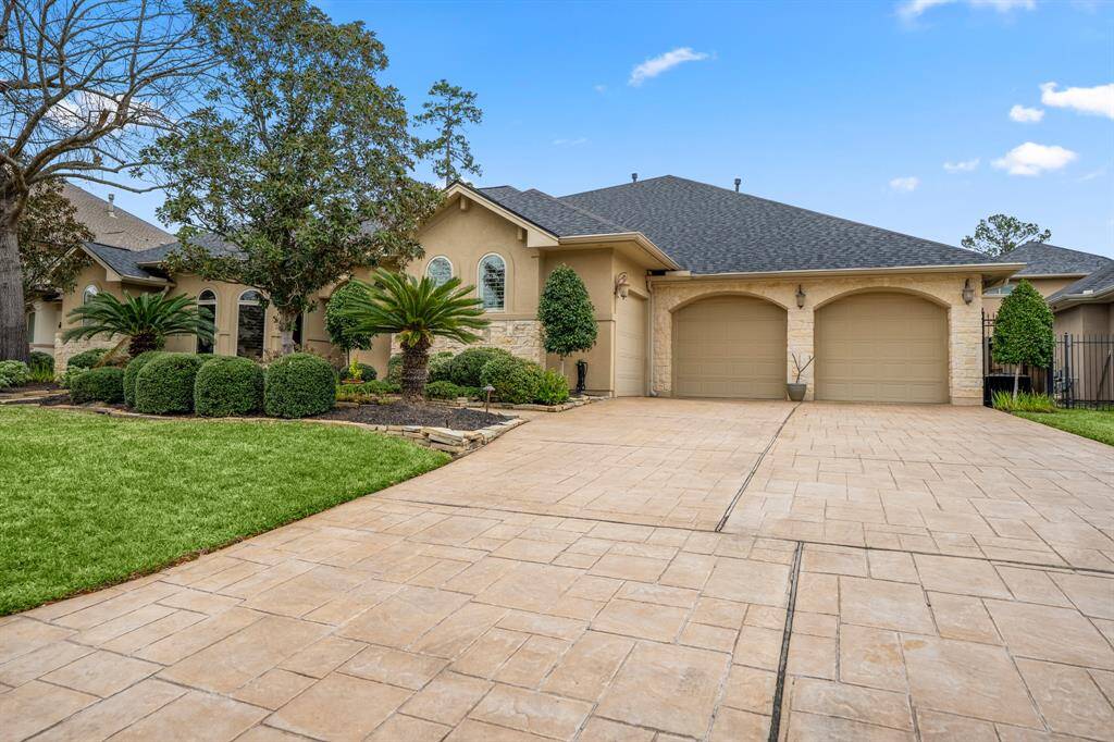The 3-car garage with double-wide extended driveway not only offers you plenty of parking space, there is already an outlet for an EV charger and the single bay is air conditioned.