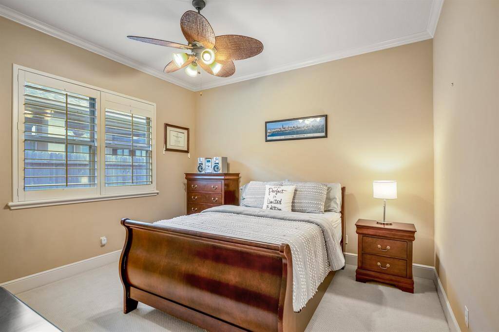 Similar in design, this bedroom offers a comfortable layout with soft carpeting and a spacious closet. The room's neutral tones create a calming environment.