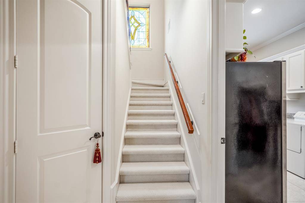 The stairs leading you to the game room upstairs are conveniently located at the end of the hall from the secondary bedrooms.