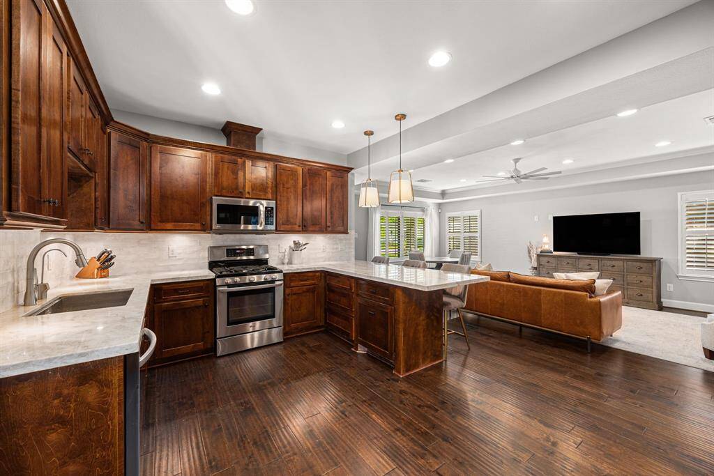 Large Kitchen with updated backsplash and countertops
