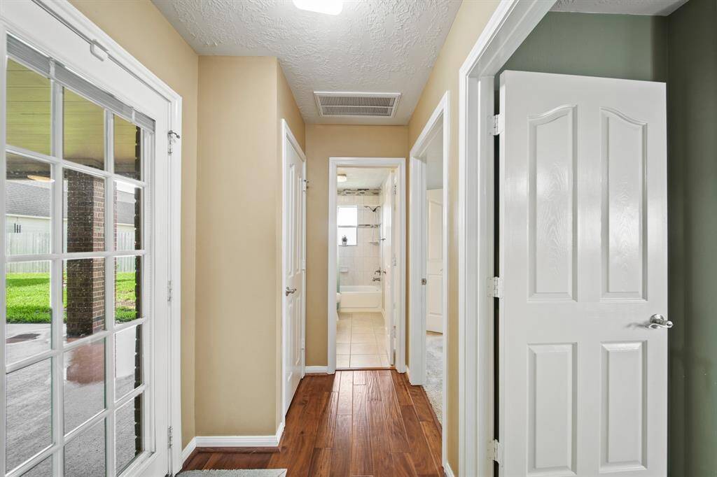 Hallway to outside patio / bathroom / bedrooms