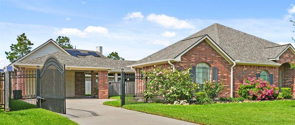 Gated driveway offers both beauty and security for vehicles / pets / children