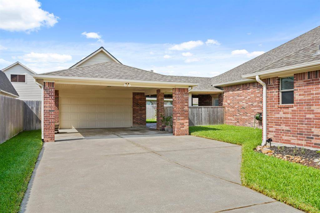 Oversized garage with porte-cochere & barn loft storage waiting for your own design