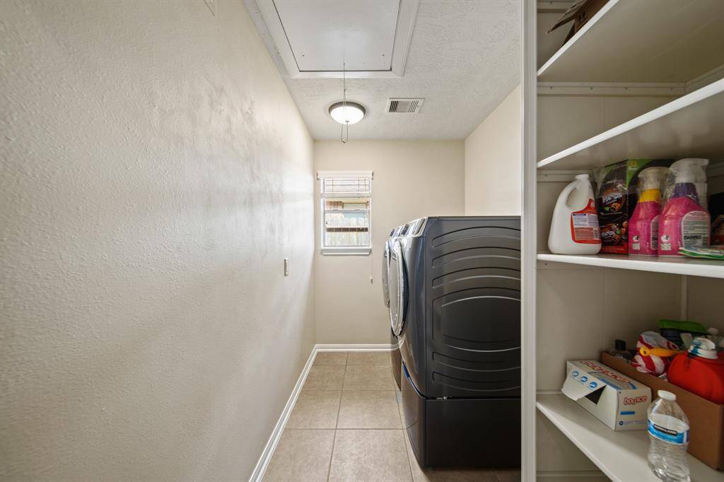 Laundry room with storage shelf