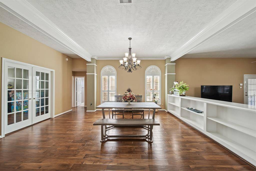 Spacious formal dining layout with hardwood floors and abundant natural light.