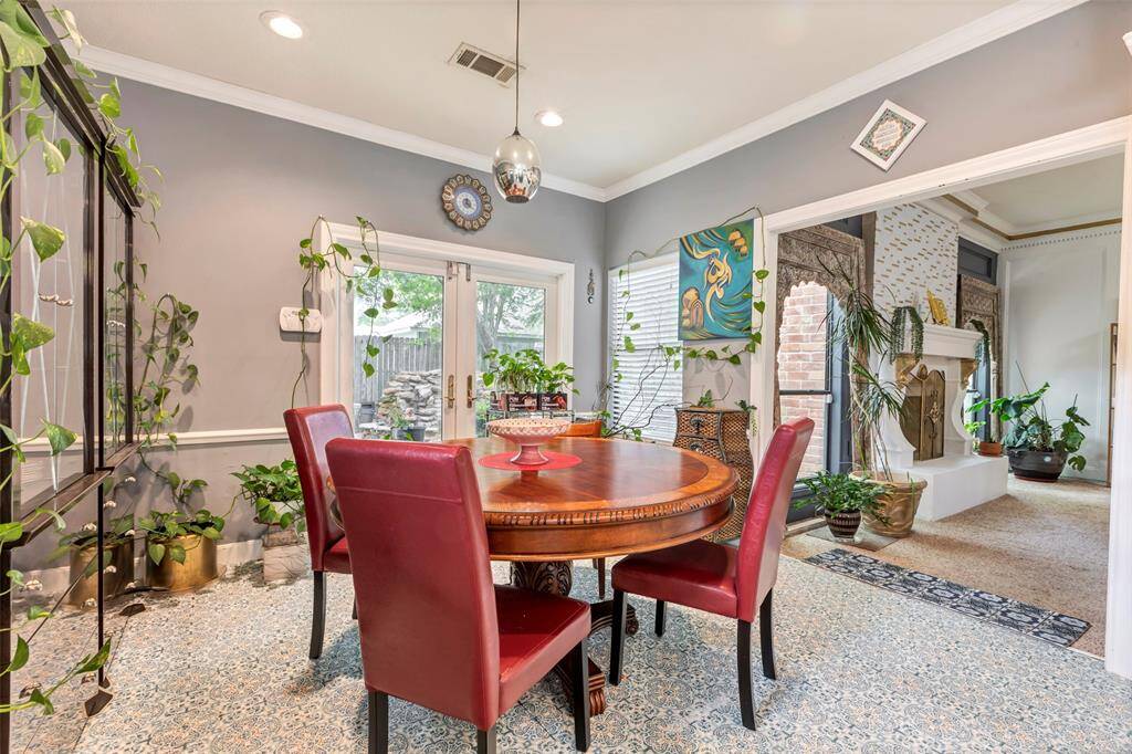 This inviting breakfast area is well lit with abundant natural light from large windows.