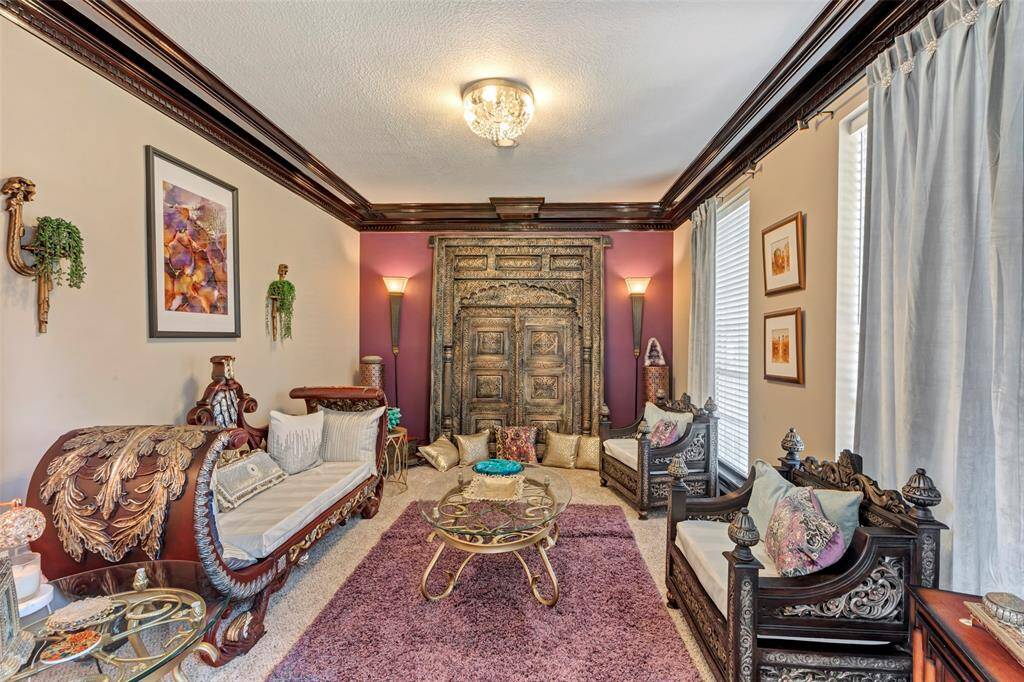 This flexible room is perfect as a formal living room or a study. The large windows provide plenty of natural light.