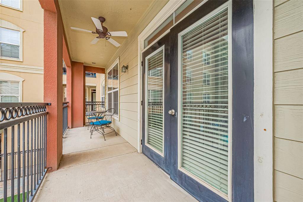 The private balcony offers ample space for outdoor seating, topped by a ceiling fan—an ideal perch for morning coffee or evening relaxation.