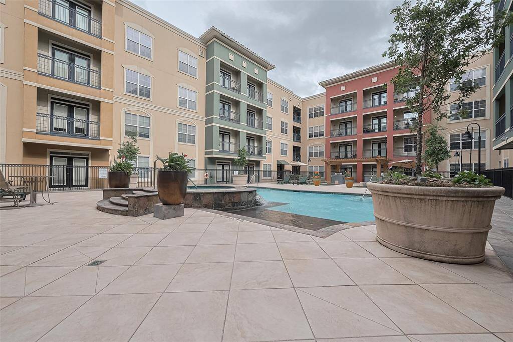 A centerpiece of the community, the shimmering pool and hot tub offer a refreshing escape—complete with lounging areas.