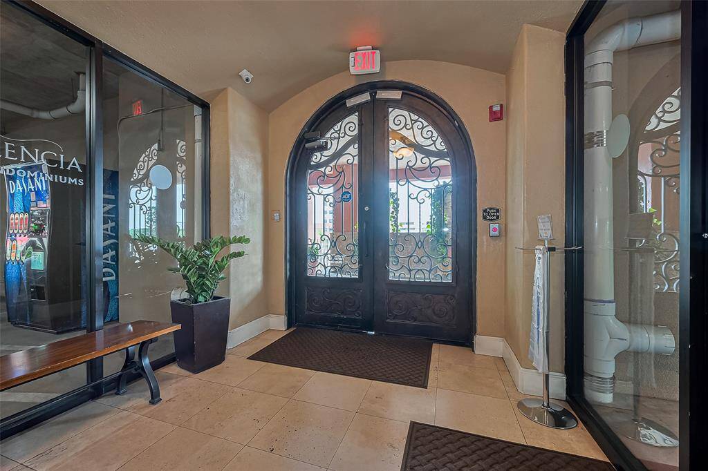 An elegant introduction to the community, the main entrance showcases large double doors framed by stylish design elements.