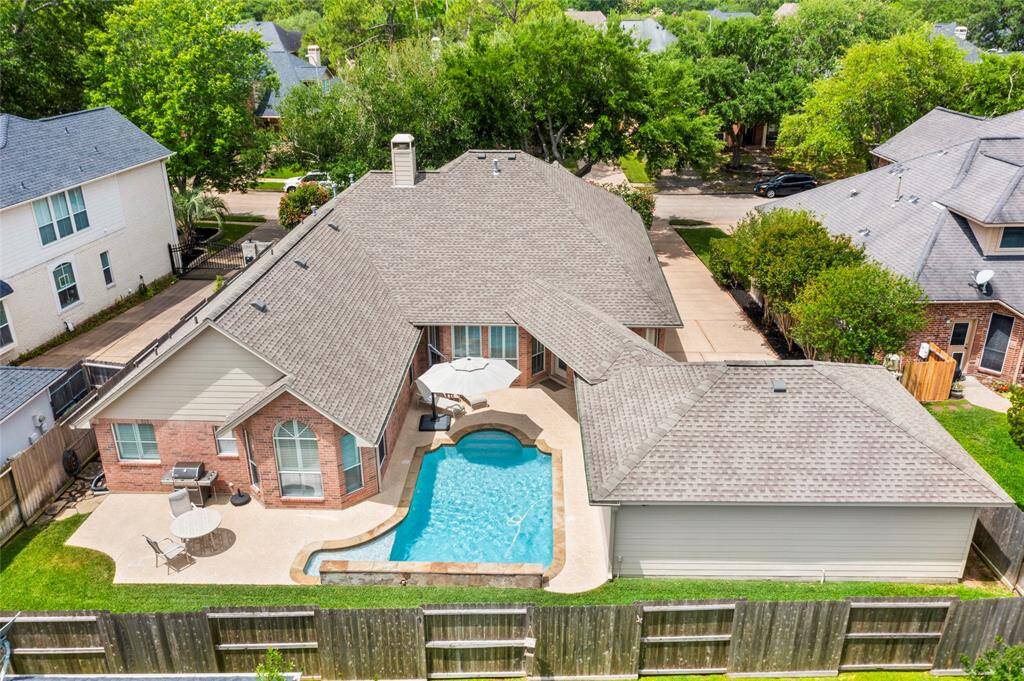 Every corner of this amazingly manicured lot is functional! There is plenty of green space for the family pets or even a trampoline.