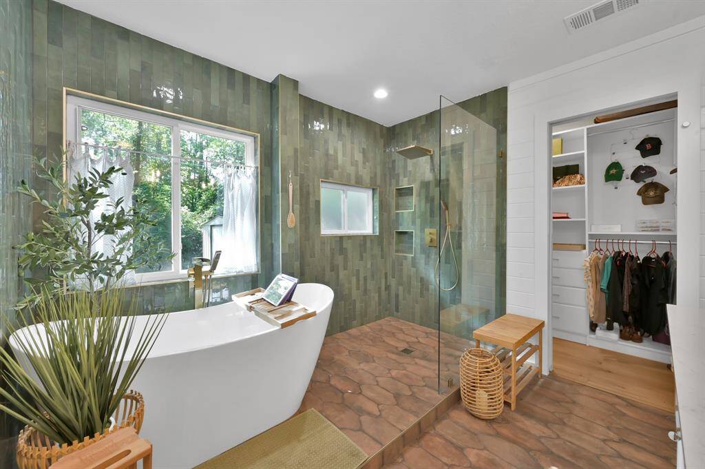 Spa inspired soaking tub and oversized walk-in shower w/ rain faucet