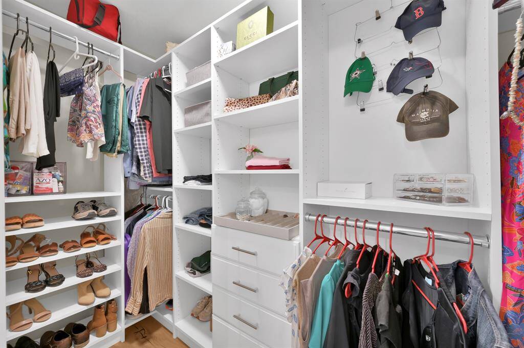 Hug walk-in closet w/ custom storage shelving