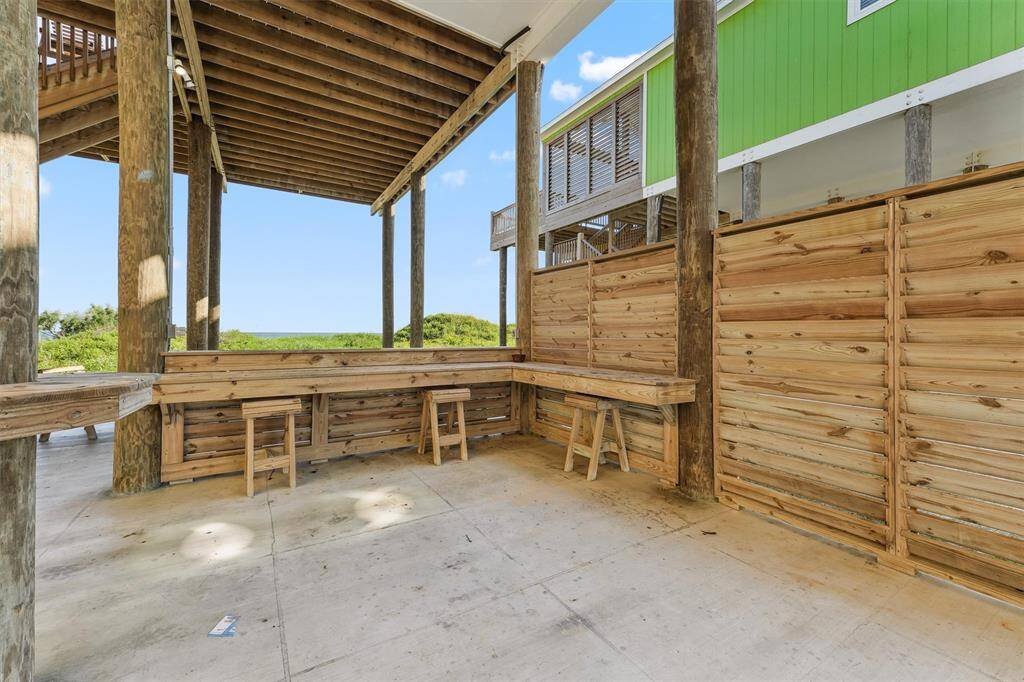 A warm welcome awaits at this charming blue beach cottage with coastal decor and a breezy vibe.