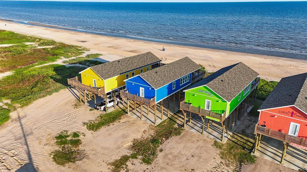 Eye-catching curb appeal and oversized decks set the tone for laid-back beachside living.