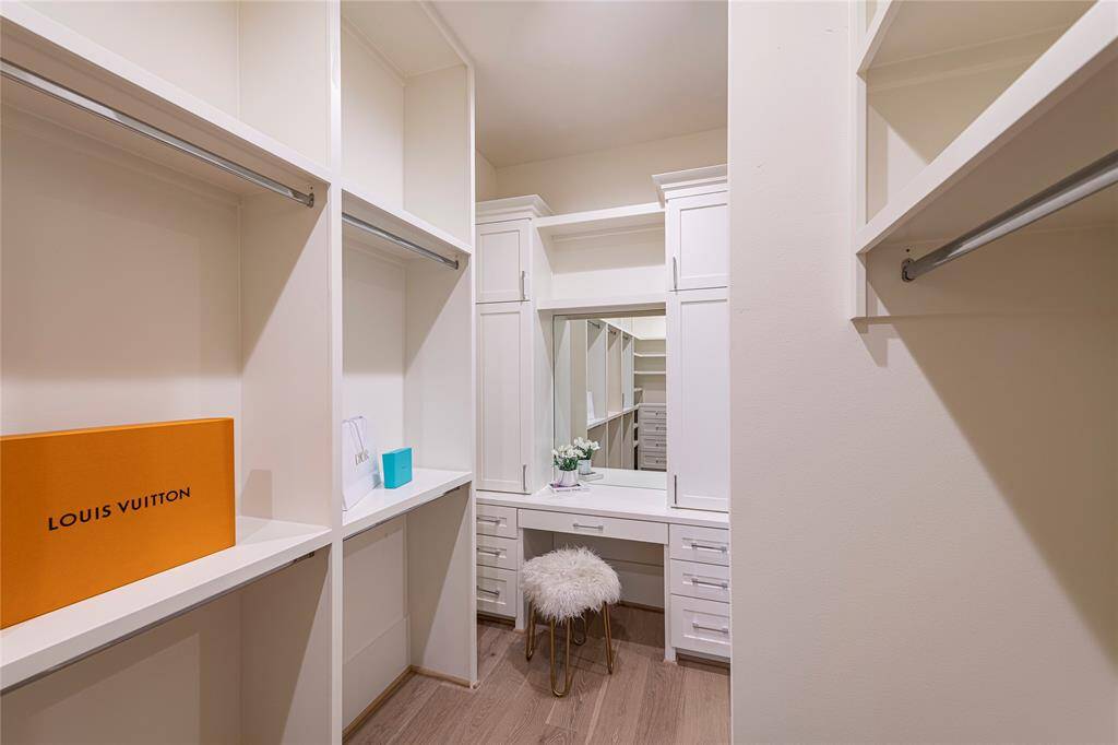 This beautiful closet also includes a dressing table.
