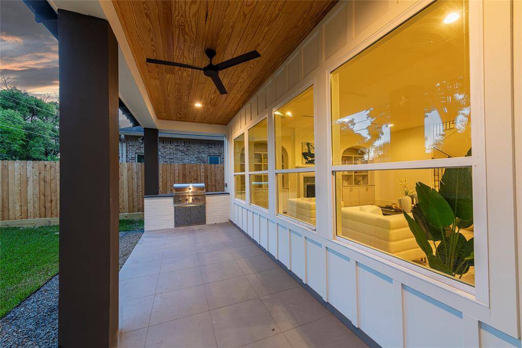 Outdoor patio with built in kitchen and outdoor shower (not pictured).