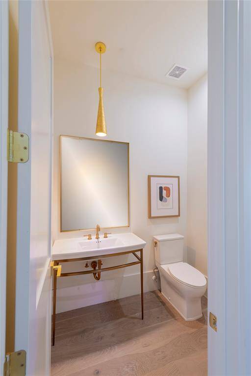 One of two elegantly designed first floor powder rooms.