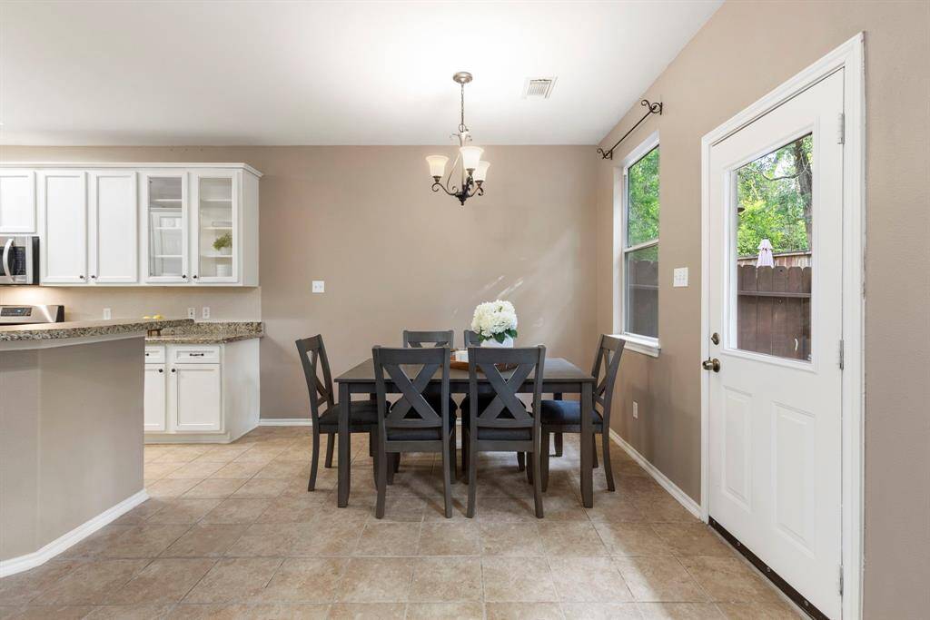 The breakfast room is conveniently located just off the kitchen, perfect for everyday meals and easy access.