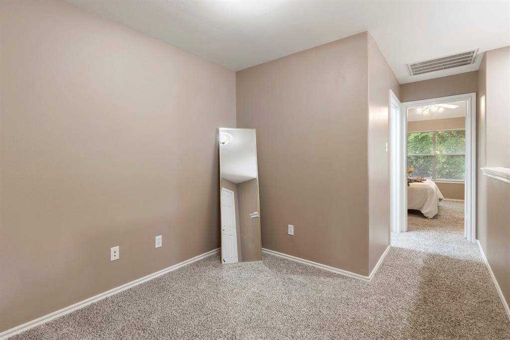 As you walk up the stairs, you’ll find this versatile flex space, perfect for a home office, play area, or additional seating.