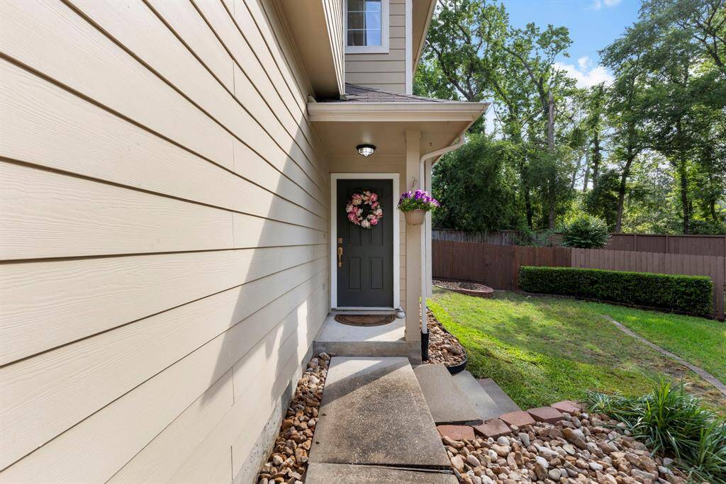 Newly updated landscaping including stair steps, new sod & bull rock to make this townhouse low maintenance.