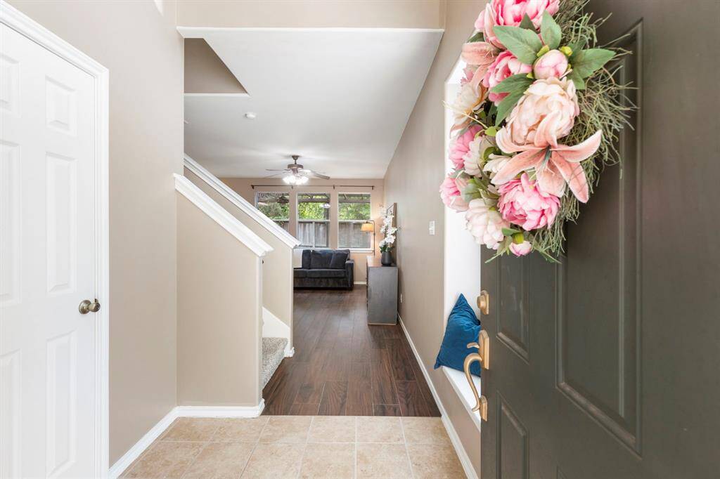 Step into a bright entryway with a charming bay window that fills the space with natural light.