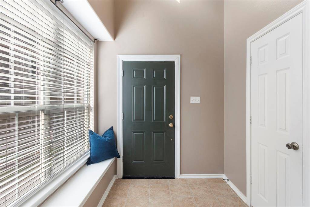 A view of the bay window, front door & powder bath entrance.