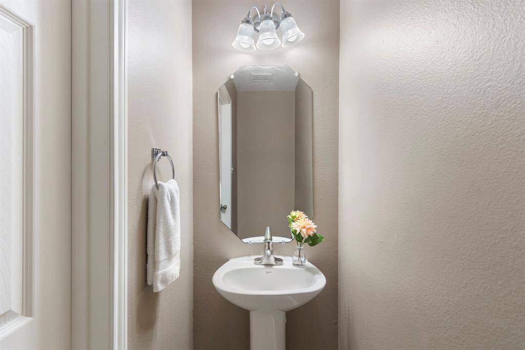 An adorable powder bath serves your guests downstairs.