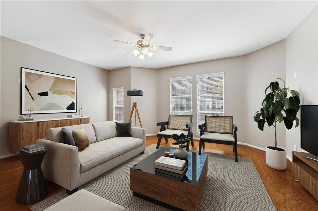 Living area virtually staged. It is very spacious and lends itself to many different furniture configurations