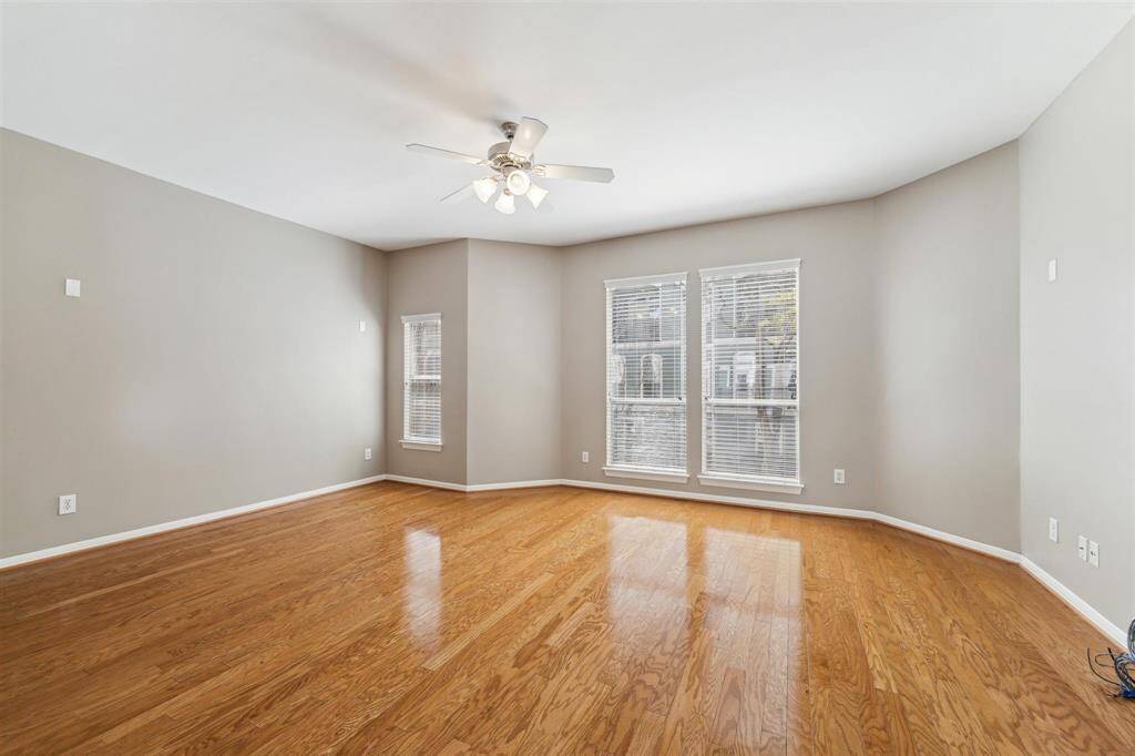 Expansive living room with natural lighting looking out over the gree espanade