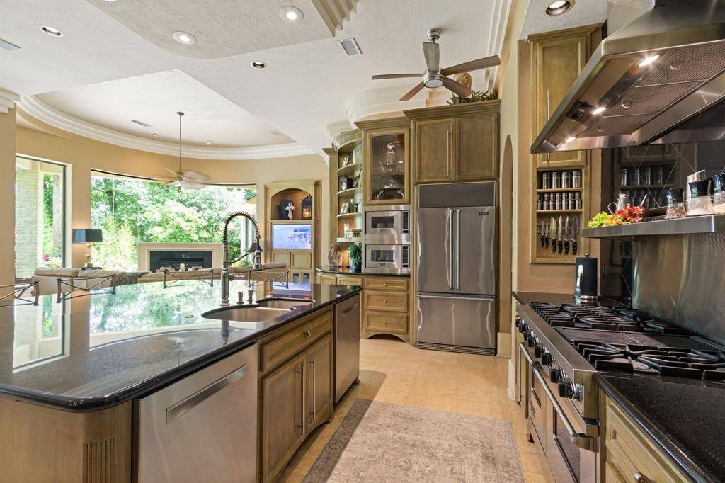 This kitchen is complete with double dishwashers, double Viking microwaves, Viking Built-in Refrigerator, and tons of white oak cabinetry for your storage. The Chef in the family will absolutely the custom built seasoning cabinets, knife stations and utensil racks.