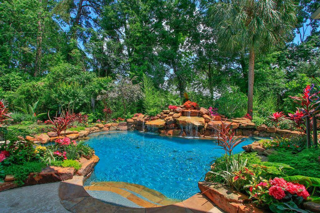 Why go on vacation when you have your own resort style backyard. The lagoon-style pool is a stunning compromise between architectural elegance and natural beauty featuring 35 tons of moss rock, a marbled WetEdge surface. Recently replaced  pool heater and Polaris pump.