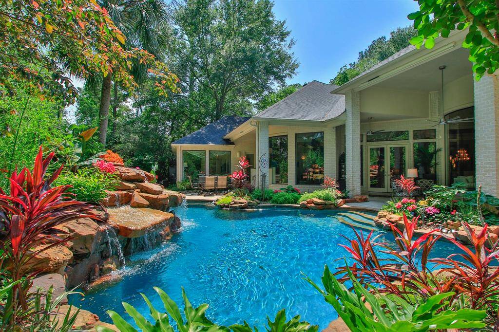 This 1.6 acre lot is beautifully landscaped around the home with natural forest borders for ultimate privacy. At night the home transforms, taking the on ambiance of an island resort,  with stunning views through its expansive walls of glass!