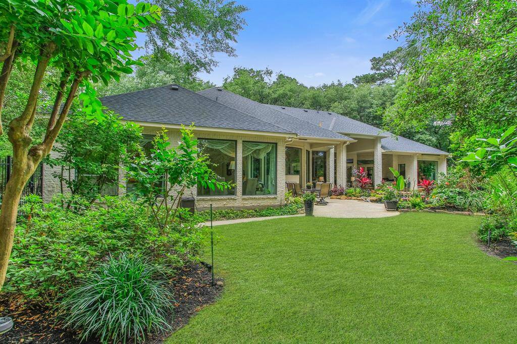 Charming single-story home with a spacious backyard, featuring lush landscaping and a generous patio area. Ideal for outdoor relaxation and entertaining. Upgrades include a 400 lb asphalt shingle roof. Two 5-ton, 20 seer Trane HVAC units with digital thermostats and weather stations. Two tankless water heaters.