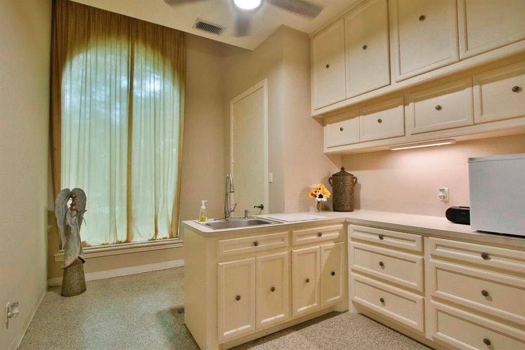 Sound-treated flex room off the 3 car garage complete with separate ventilation - idea for an art studio, workshop, gym, remote study or whatever your family's needs will be for this fabulous space!