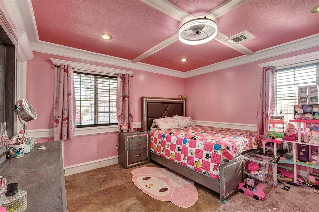 Charming pink-themed bedroom provides the perfect space for a child,