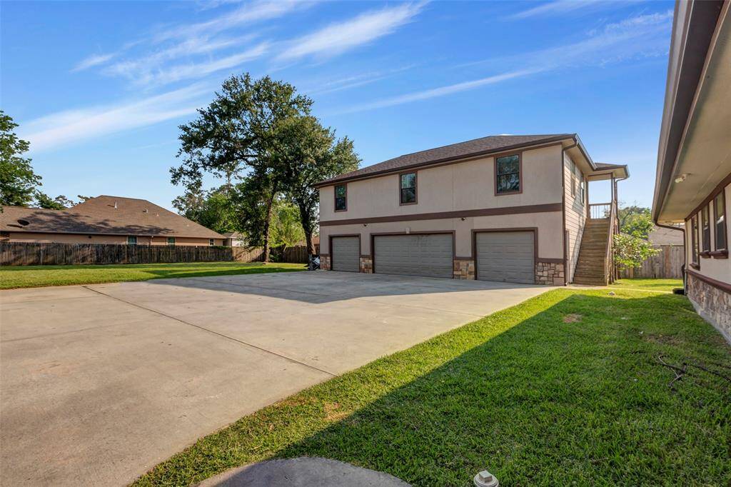 View of the apartment and the detached 4 car garage.