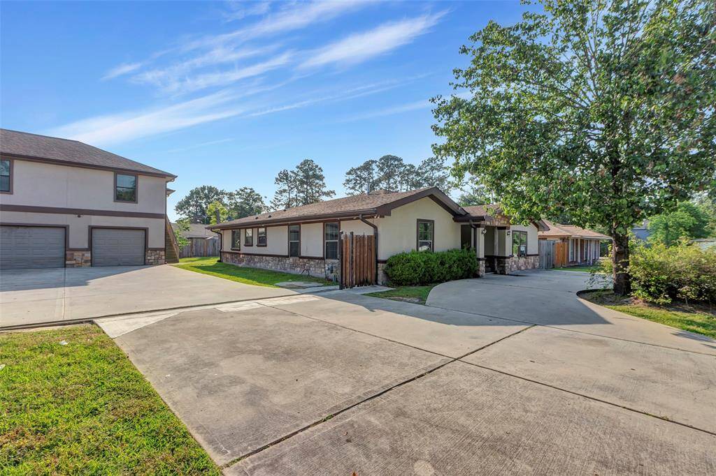 Spacious driveway leads to both the main house and the apartment, offering ample parking and a private entrance.