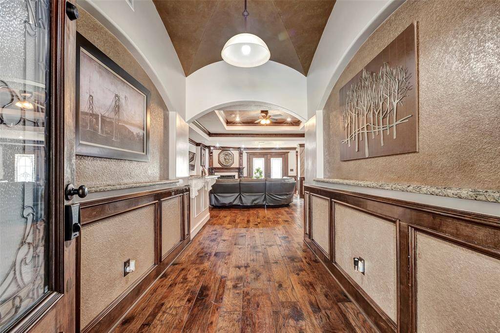 Step inside to a grand foyer with soaring high ceilings.