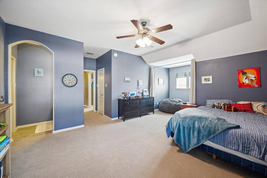 One of three guest bedrooms on the 2nd floor features walk-in closet and charming reading nook.